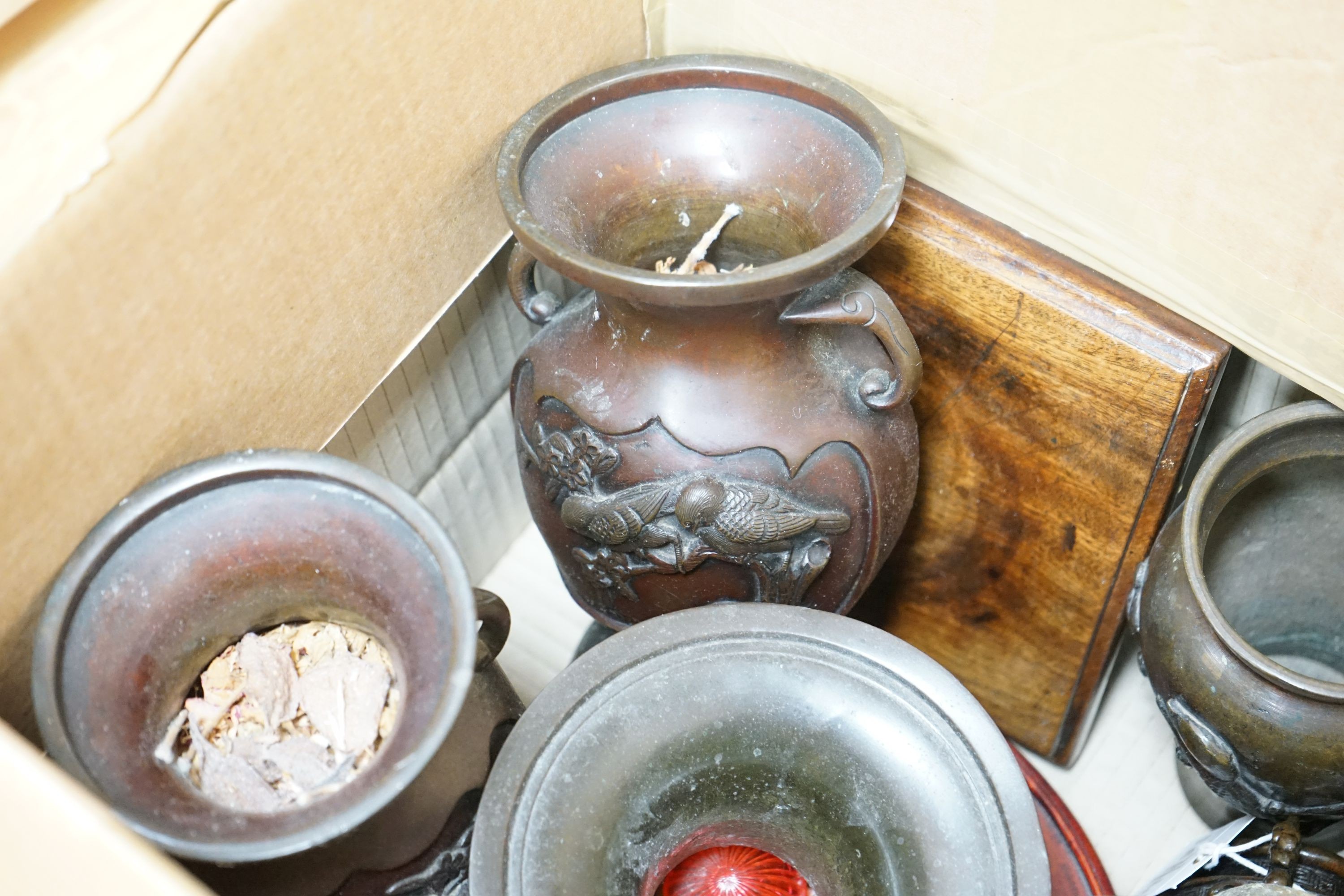 A group of Japanese bronze vases and sundry hardwood stands